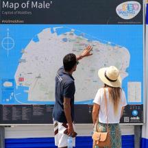 a man and a woman looking at a map