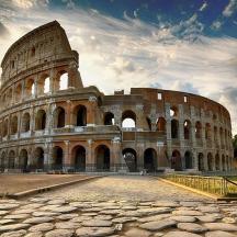 a large amphitheater with the colosseum in front of it