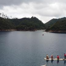 a group of people on a boat in a lake