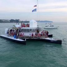 a group of people on a boat in the water