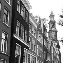 a black and white photo of a building with a clock tower