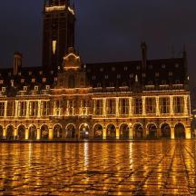 a large building with a clock tower at night