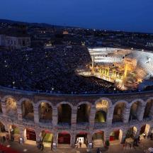 a large crowd of people in an arena at night