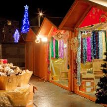 a christmas display of a house with a christmas tree