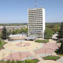 a large building in a city with a park