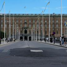 a large building with people walking in front of it