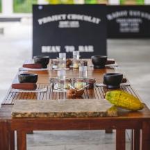 a wooden table with food and drinks on it