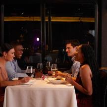a group of people sitting at a table in a restaurant