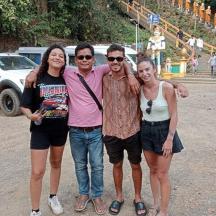 a group of three people posing for a picture