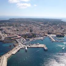 an aerial view of a harbor with boats in the water