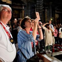 a man taking a picture of a crowd of people