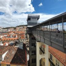 a balcony of a building with a view of a city