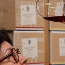 a person holding up a glass of wine