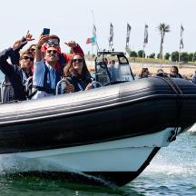 a group of people riding on a boat in the water
