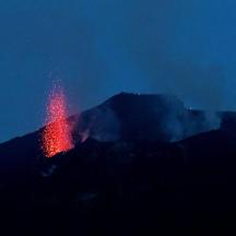 a mountain with a red substance on top of it