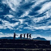 a group of people standing on top of a mountain