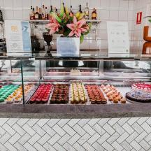 a display case with many different types of donuts