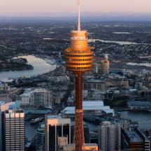 an aerial view of a city with a tower
