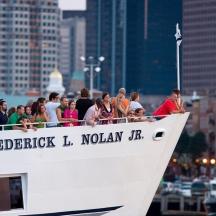 a group of people riding on the back of a boat