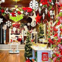 a store with christmas trees and christmas decorations