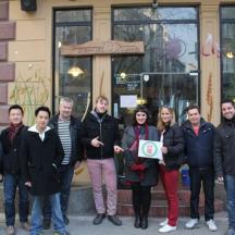 a group of people standing in front of a building