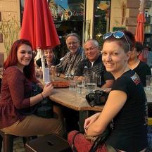 a group of people sitting at a table in a restaurant