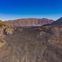 an aerial view of a mountain with a road