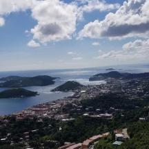 an aerial view of a city and a body of water