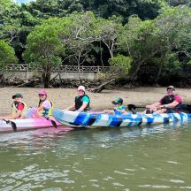 a group of people in a boat on the water