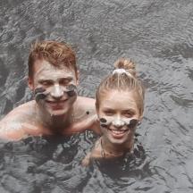 a man and a woman in the water with face masks