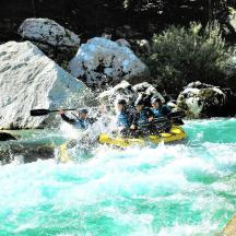 a group of people on a raft in a river