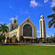 a large building with a tower and a church