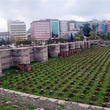 a large cemetery in a city with buildings