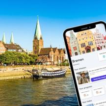 ein Handy vor einem Fluss mit einer Stadt
