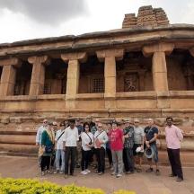 a group of people standing in front of a building