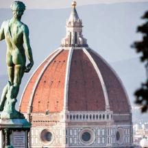 a statue of a man on top of a building