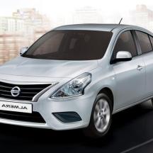 a white nissan accentamine parked in a city