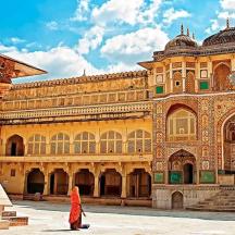 a woman standing in front of a large building