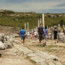 a group of people walking through the ruins