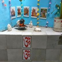 a table with a fountain on a blue wall