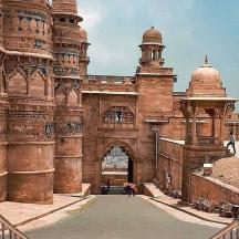a large brick building with an archway in it
