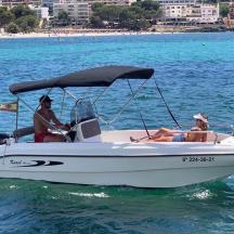 a man and a woman in a boat on the water