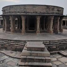 a building with a circularvisor in the middle of a courtyard