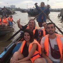 a group of people in a boat in the water
