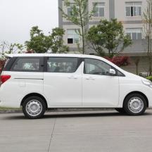 a white small car parked in a parking lot