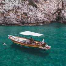 a group of people on a boat in the water
