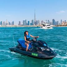 a woman riding a jet ski in the water