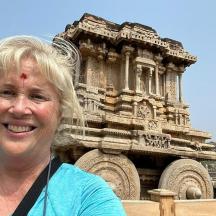 a woman standing in front of a building