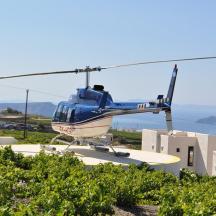 a blue helicopter sitting on top of a building