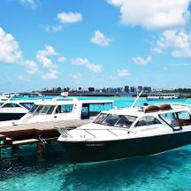two boats docked at a dock in the water